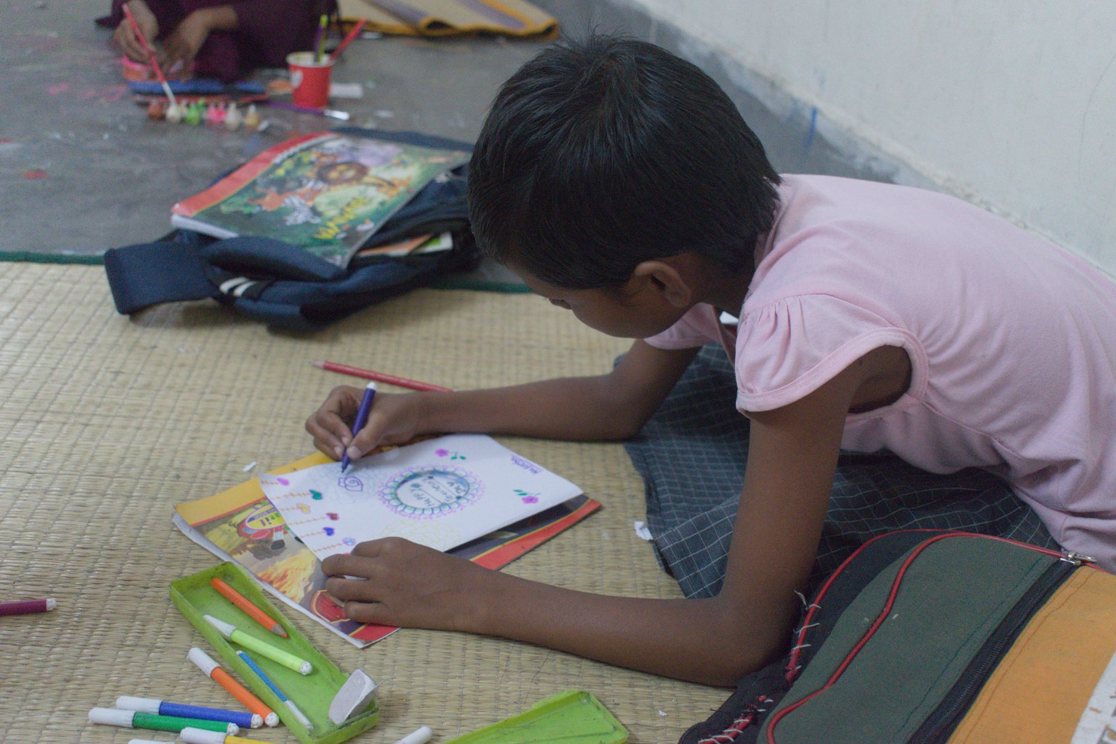 Girl drawing at learning session